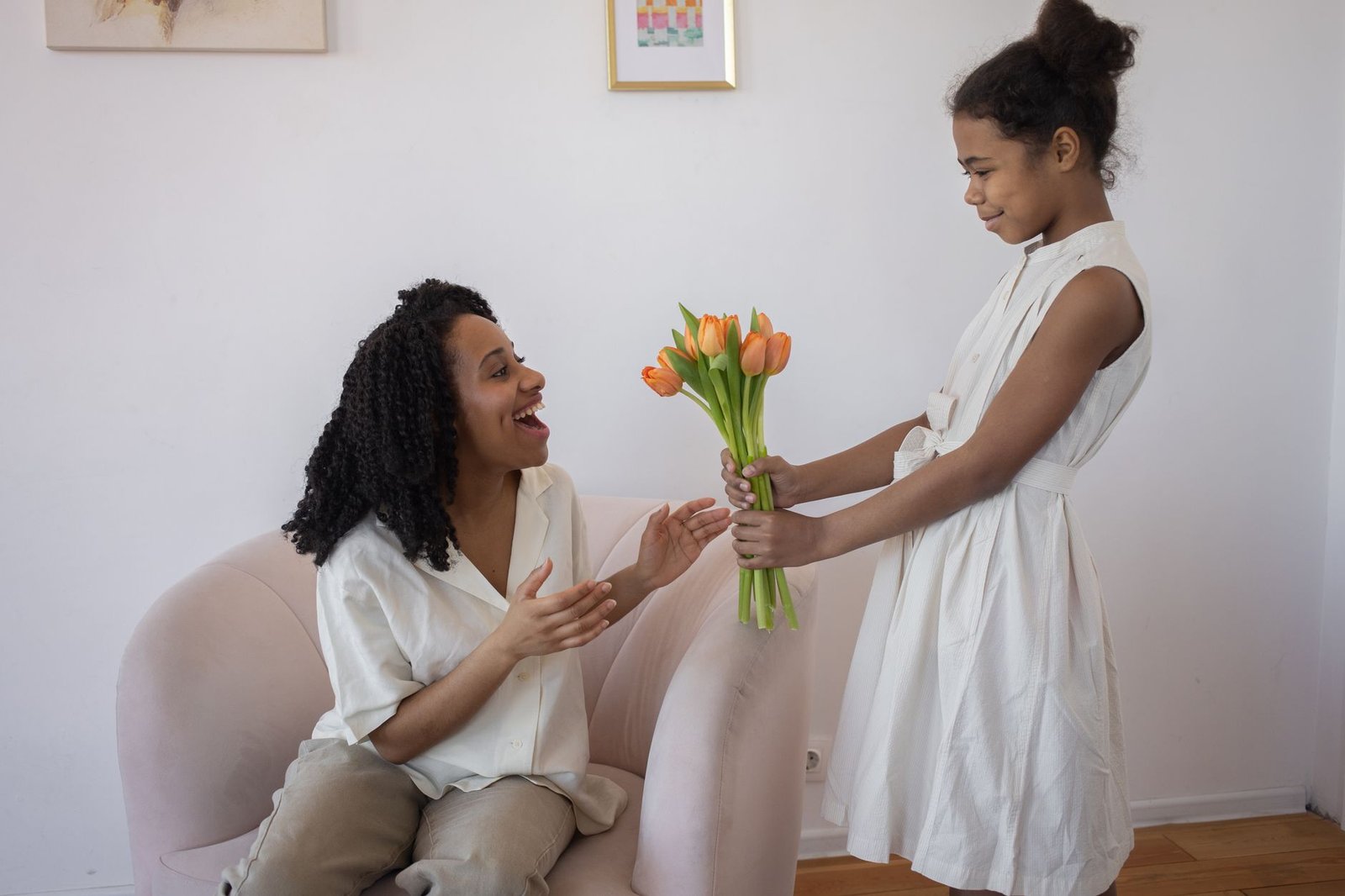 daughter hugging mother with a card